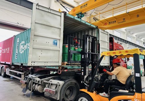 In-house container loading. Coil orientation and securing follow the shipment plan.
