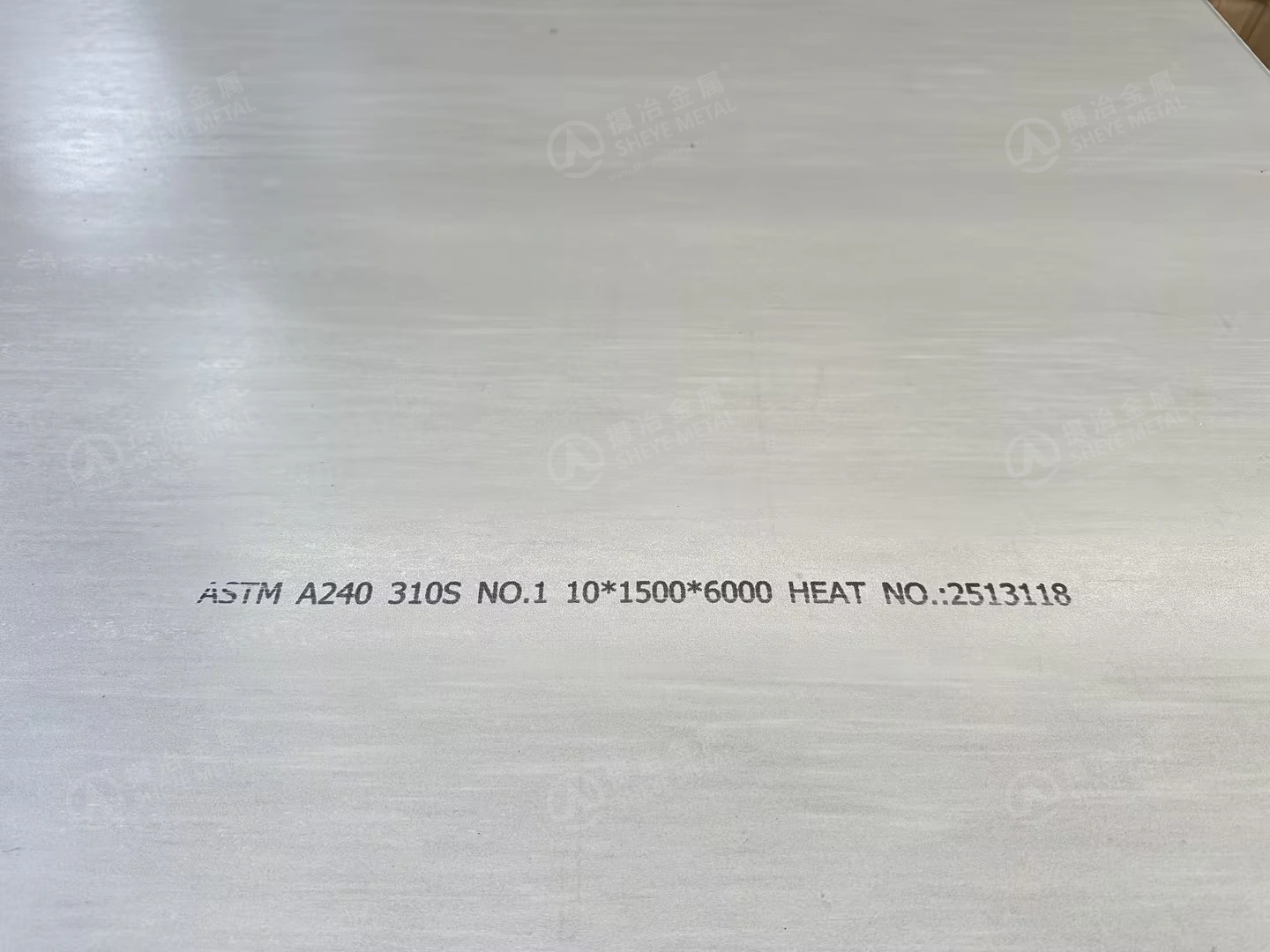 Plate marking showing ASTM A240, 310S, No.1 finish, 10 × 1500 × 6000 mm and a heat number.