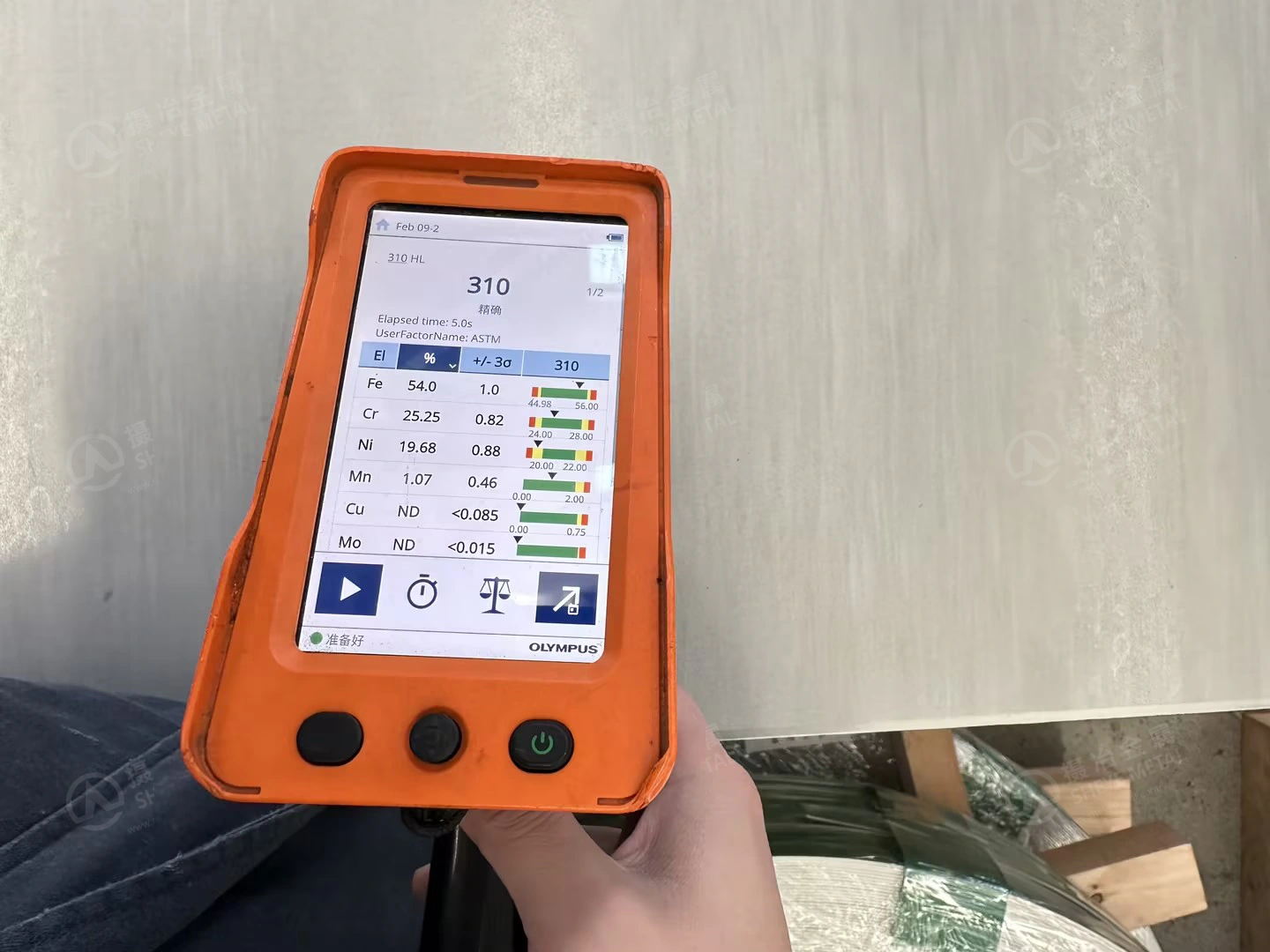 Handheld XRF analyser checking alloy elements on the 10 mm plate supplied as 310S for Vietnam.